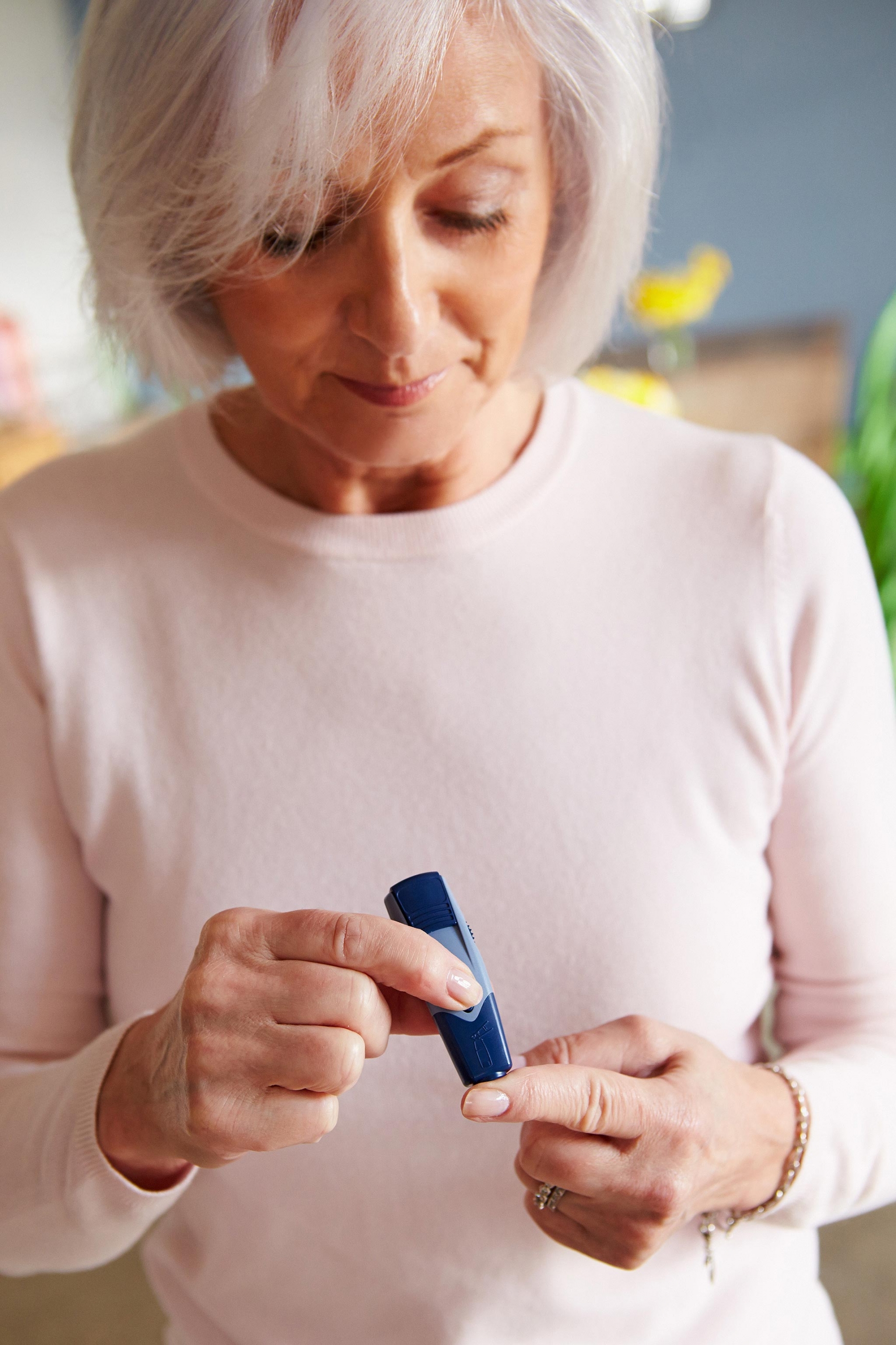 Woman checking blood sugar levels